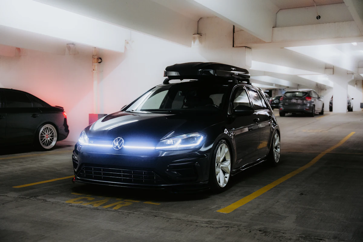 Black car with a roof box on the roof